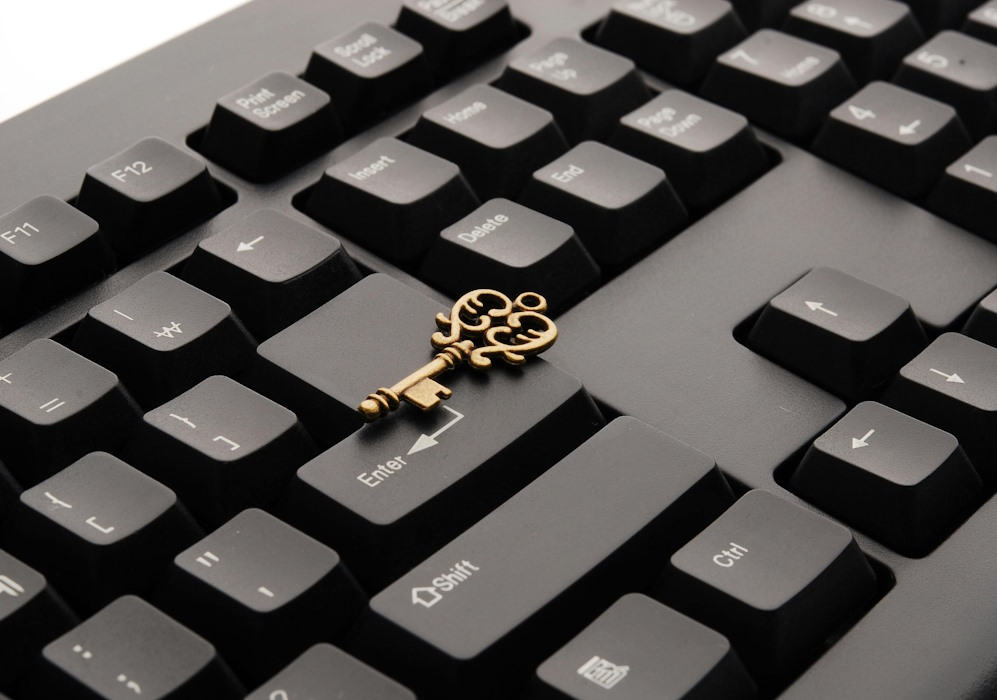 Clavier avec une clé, symbolisant la protection sécurisée des données confiées à All Docs.